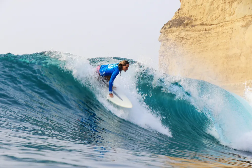 Women surfing at sunset